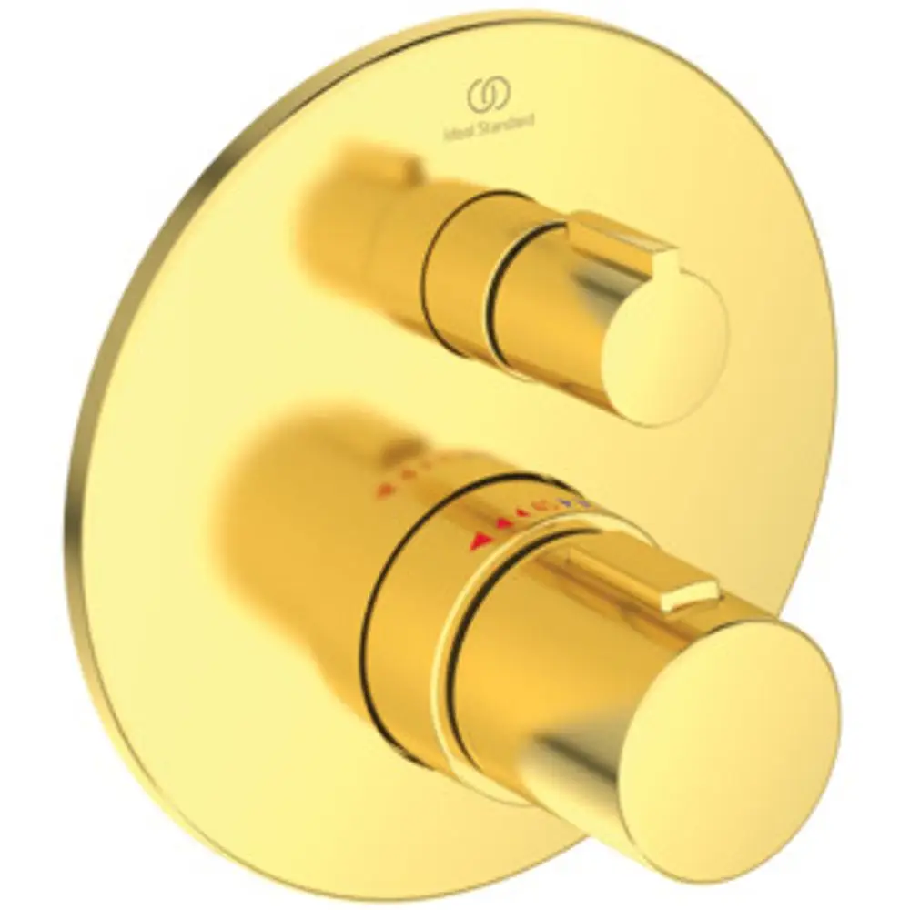 Goldfarbener Wandthermostat mit zwei Steuerknöpfen. Die Abdeckung hat eine runde Form und ist mit dem Logo von Ideal Standard versehen.